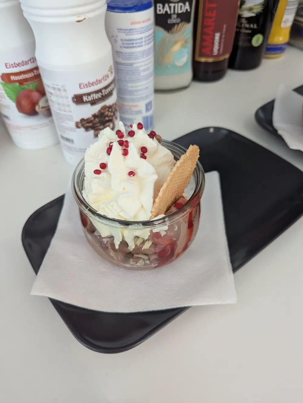 Ice cream sundae with cream, wafer & sugar pearls