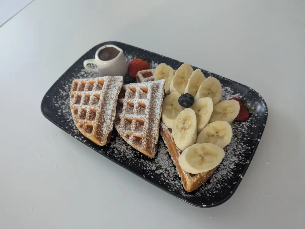 Americano waffles with banana, berries & chocolate sauce